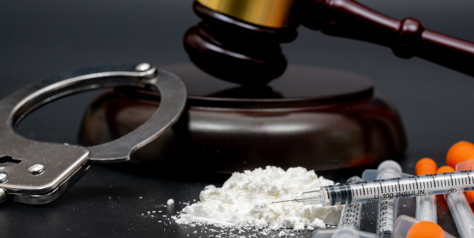 drugs, handcuffs and gavel