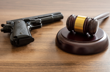 Gun next to gavel