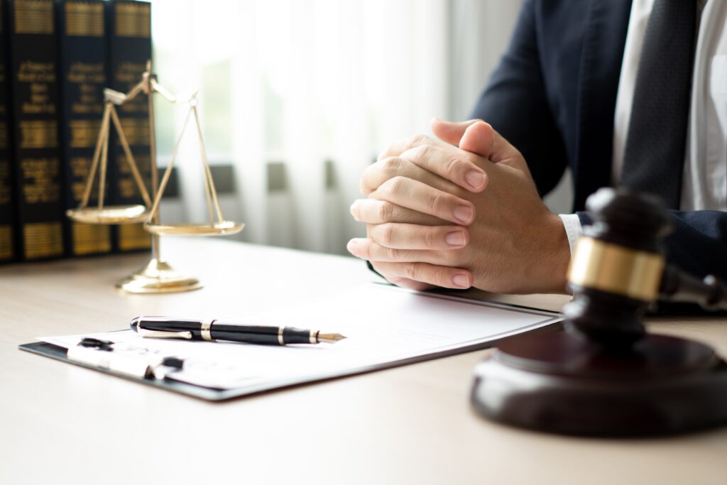 Criminal defense lawyer sitting at desk